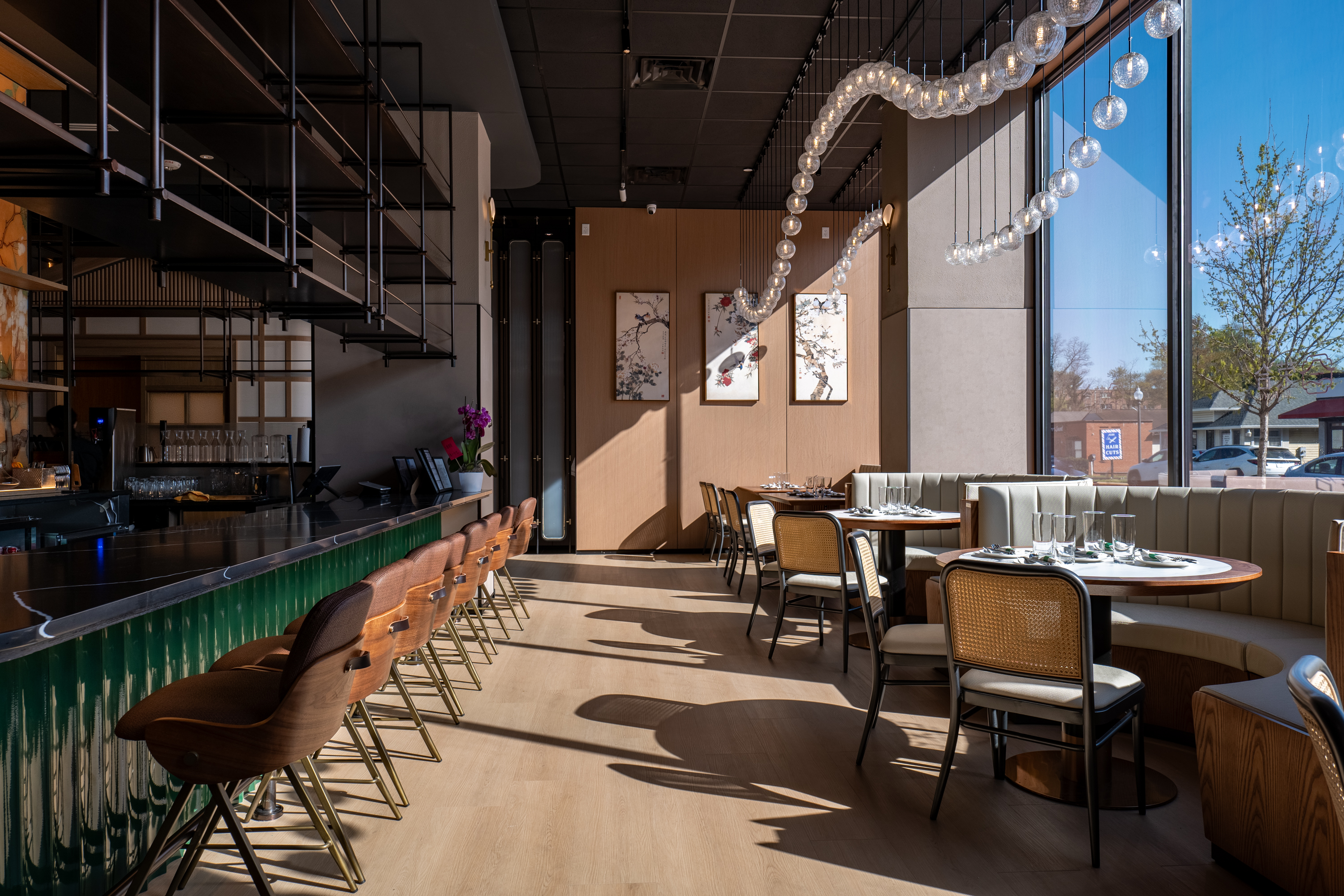 Tamu restaurant dining area with bar stools and pendant lights